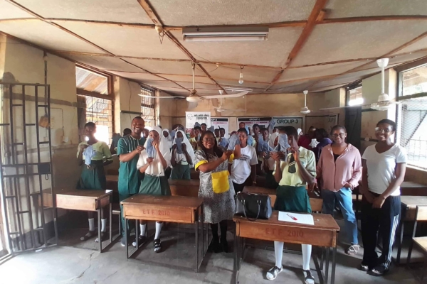 Students showing off their created reusable sanitary pads.