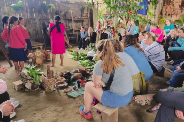 Group of interns get a lecture from locals.