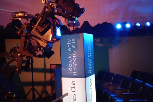 A dinosaur type robot from the robotics internship in Ecuador being presented.