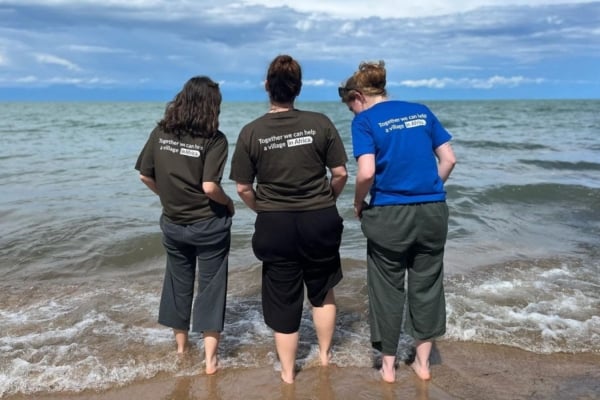 Three medical interns getting their feet wet at the beach in Malawi.