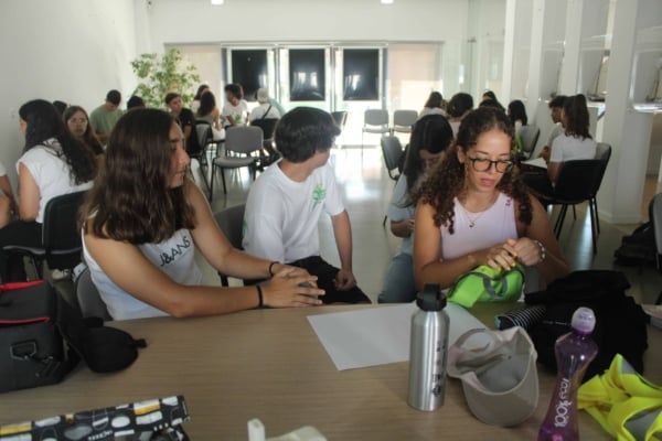 A class of interns grouped up during an activity.