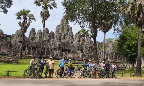 group of tourists with bike in Cambodia